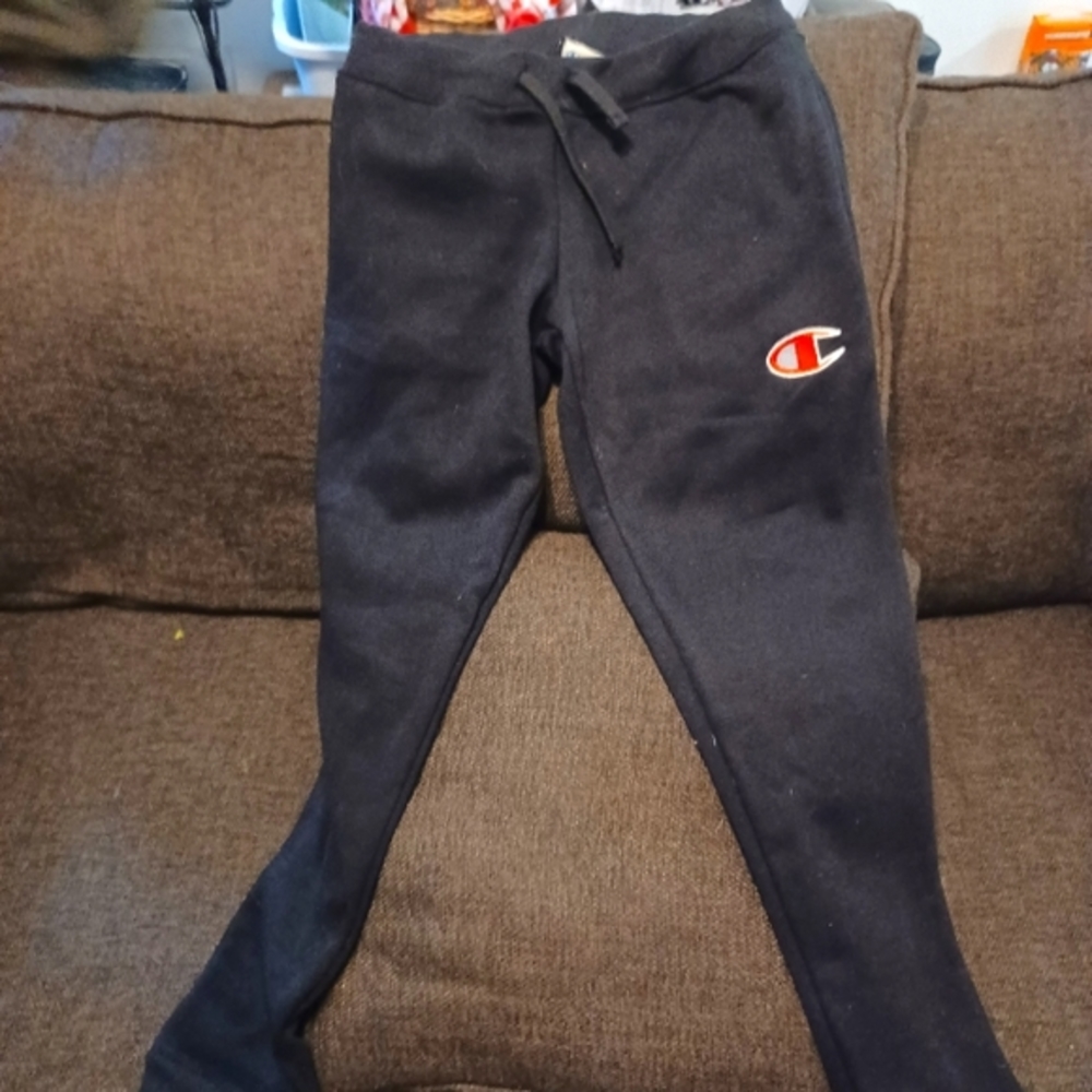 Champion polyester joggers, size medium, black with Champion embroidered logo.